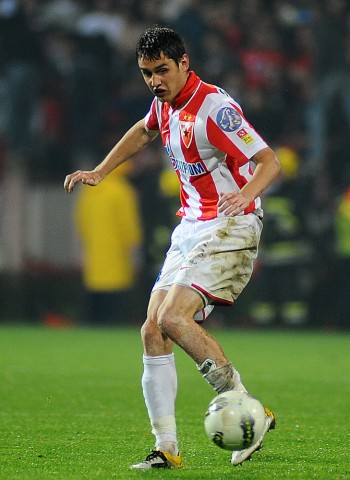 Srdjan Mijailovic of FK Crvena zvezda on the ball whilst under News  Photo - Getty Images